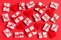 Top view of white gift boxes and red textile hearts on colorful background. Valentine`s Day concept Royalty Free Stock Photo