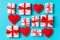 Top view of white gift boxes and red textile hearts on colorful background. Valentine`s Day concept Royalty Free Stock Photo