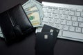 Top view of white keyboard money dollars wallet and credit cards isolated on table. Royalty Free Stock Photo