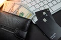 Top view of white keyboard money dollars wallet and credit cards isolated on table. Royalty Free Stock Photo