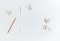 Top view of white notepaper with paperclip on worktable.minimalist style