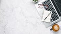 Top view, White Office desk with laptop computer, eyeglass, cup of coffee, pen and notebook, copy space, Mock up Royalty Free Stock Photo