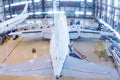 Top view of a white passenger aircrafts in the hangar. Airplanes under maintenance