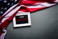 Top view of white picture frame with Flag of the United States of America on wooden background.  Independence Day USA, Memorial Royalty Free Stock Photo