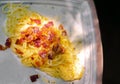 Top view of a white plate carbonara cheese.
