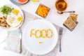 Top view white plate with Food word lettering by vitamin pills on the served wooden table with breakfast meal. Pill instead of foo Royalty Free Stock Photo