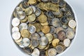 Top of view white plate full of euro coins