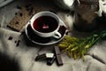 Top view of white porcelain glass cup of red tea karkade on canvas tablecloth. Homemade chocolate chip cookies, lemon Royalty Free Stock Photo