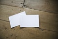 Top view of white postcard or papers on old wooden background Royalty Free Stock Photo