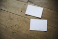 Top view of white postcard or papers on old wooden background Royalty Free Stock Photo