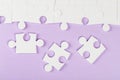 Top view, white puzzles on purple background