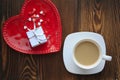 White ring box with silver bow mug of coffee and candy Royalty Free Stock Photo