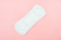 Top view white sanitary napkin isolated on pink background. Woman hygiene, Concept of critical days, menstruation,health care Royalty Free Stock Photo