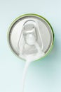 Top view of white soda foam splashing over the aluminum beverage Royalty Free Stock Photo