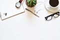 Top view white table, Design your own desk with book, pen, glasses, black coffee and wristwatch is elements. Royalty Free Stock Photo