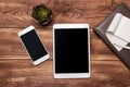 Top view of white tablet blank black screen for advertisement display or other app design with smartphone Royalty Free Stock Photo