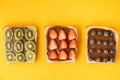 Top view of white toast bread slices with chocolate hazelnut spread decorated with fresh summer berries: strawberries, blueberries Royalty Free Stock Photo