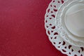 Top view of white vintage tableware set on red background. Empty porcelain plates Royalty Free Stock Photo