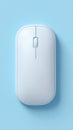 Minimalist Wireless Computer Mouse on a Light Blue Background, Top View Royalty Free Stock Photo