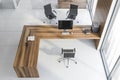 Top view of white and wood manager office