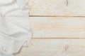 Top view on a white wooden table with a linen kitchen towel or textile napkin. a tablecloth on a light wood countertop Royalty Free Stock Photo