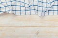 Top view on a white wooden table with a linen kitchen towel or textile napkin. a tablecloth on a light wood countertop Royalty Free Stock Photo