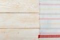 Top view on a white wooden table with a linen kitchen towel or textile napkin. a tablecloth on a light wood countertop Royalty Free Stock Photo