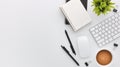 Top view white wooden workspace office desk with computer and office supplies. Flat lay work table with blank notebook, keyboard, Royalty Free Stock Photo