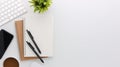 Top view white wooden workspace office desk with computer and office supplies. Flat lay work table with blank notebook, keyboard, Royalty Free Stock Photo