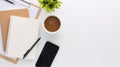 Top view white wooden workspace office desk with computer and office supplies. Flat lay work table with blank notebook, keyboard, Royalty Free Stock Photo