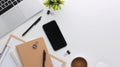 Top view white wooden workspace office desk with computer and office supplies. Flat lay work table with blank notebook, keyboard, Royalty Free Stock Photo