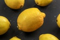 Top view - whole lemons on black marble board