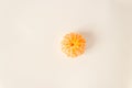 Top view of whole pelled tangerine citrus orange fruit on a white background. Fasting day with healthy fruitarian snack.