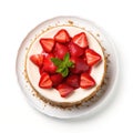 Top view of a whole strawberry cheesecake on a plate.