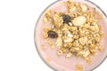 Top view wholegrain muesli on top of strawberry flavor yogurt Royalty Free Stock Photo