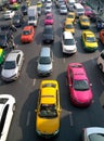 Top view of a wide street with multi-lane traffic, heavy traffic from colorful cars