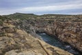 Top view of the Wied il-Ghasri gorge on the northern shore of GOZO island. Mediterranean sea, rocky coast, January Royalty Free Stock Photo