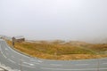 Top view of a winding mountain road in fog Royalty Free Stock Photo