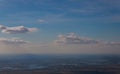 The top view from a window of the flying plane on the city from airplane earth from height