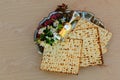 Top view wine and matzoh jewish passover bread over wooden background. Royalty Free Stock Photo