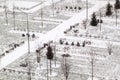 top view of winter public Park with benches, lanterns and snow-covered paths Royalty Free Stock Photo