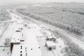 Top view at wintry rail road in evergreen forest with snow-capped trees. Winter season in Russia Royalty Free Stock Photo