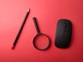 Top view wireless mouse, pencil and magnifying glass Royalty Free Stock Photo