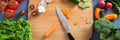 Top view of woman cooking healthy food: cutting vegetable ingredients Royalty Free Stock Photo