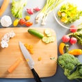 Top view of woman cooking healthy food: cutting vegetable ingredients Royalty Free Stock Photo