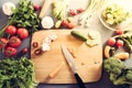 Top view of woman cooking healthy food: cutting vegetable ingredients Royalty Free Stock Photo