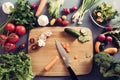 Top view of woman cooking healthy food: cutting vegetable ingredients Royalty Free Stock Photo