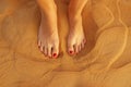 Top view of woman feet in golden desert sand Royalty Free Stock Photo