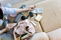 Top view woman getting ready to flight putting different personal things into handbag storage Royalty Free Stock Photo