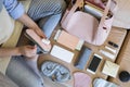 Top view woman getting ready to flight putting different personal things into handbag storage Royalty Free Stock Photo